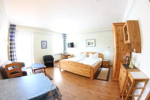 Postel nebo postele na pokoji v ubytování Ferienwohnungen und Appartements - Haus Budinger