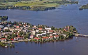 an aerial view of a small town on a lake at Hotel Tunneli in Sastamala
