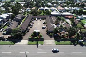 an aerial view of a parking lot with cars parked at Reign Inn Newcastle in Newcastle