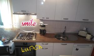 Kuchyň nebo kuchyňský kout v ubytování Luciana