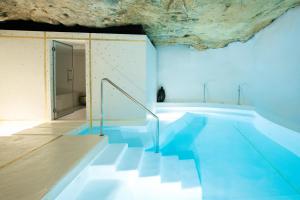 Bazén v ubytování Faustino Gran Relais & Chateaux nebo v jeho okolí