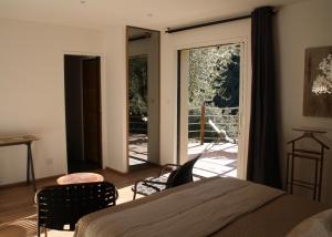 מיטה או מיטות בחדר ב-L'oliveraie du Fango