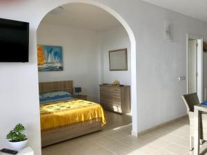 Cama ou camas em um quarto em Residencial Playa Paraiso