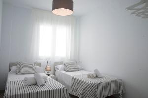 Postel nebo postele na pokoji v ubytování Entre Patios La Victoria