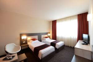 Postel nebo postele na pokoji v ubytování Hotel Galaxy