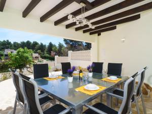 a dining room with a table and chairs at Holiday Home Grevol by Interhome in Balcon del Mar