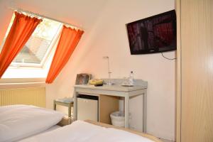 TV a/nebo společenská místnost v ubytování Hotel Wilhelmshöhe