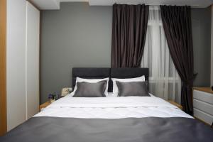 Postel nebo postele na pokoji v ubytování Emerald Boutique Hotel