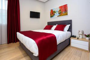Postel nebo postele na pokoji v ubytování Emerald Boutique Hotel
