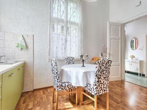 a dining room with a table and chairs at Apartment Silvia by Interhome in Pula
