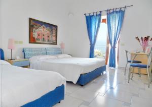 Postel nebo postele na pokoji v ubytování Hotel Holiday