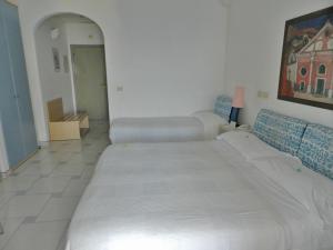 Postel nebo postele na pokoji v ubytování Hotel Holiday