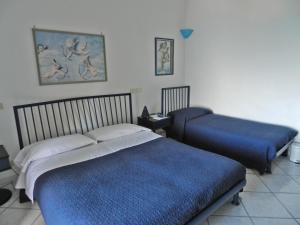 Postel nebo postele na pokoji v ubytování Hotel Holiday