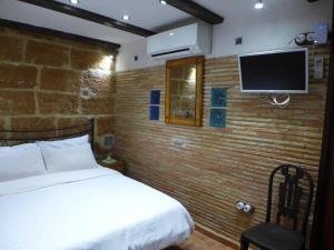 Postel nebo postele na pokoji v ubytování No1 CasaTosca Javea, Pequeña Habitación con baño en el Centro del Casco Antiguo