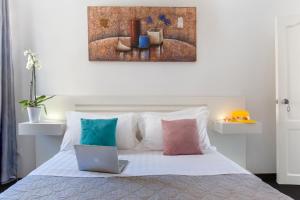 Ένα ή περισσότερα κρεβάτια σε δωμάτιο στο Hotel Herculaneum