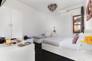 Ένα ή περισσότερα κρεβάτια σε δωμάτιο στο Hotel Herculaneum