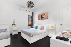 Ένα ή περισσότερα κρεβάτια σε δωμάτιο στο Hotel Herculaneum