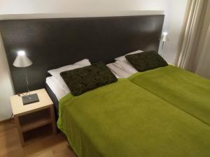 Кровать или кровати в номере Apartment Ylläs Ski Chalets 7202, Incl 2 lift tickets in winter season
