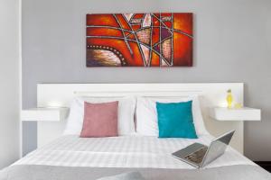 Ένα ή περισσότερα κρεβάτια σε δωμάτιο στο Hotel Herculaneum
