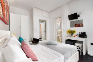 Ένα ή περισσότερα κρεβάτια σε δωμάτιο στο Hotel Herculaneum