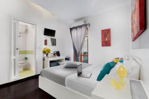 Ένα ή περισσότερα κρεβάτια σε δωμάτιο στο Hotel Herculaneum