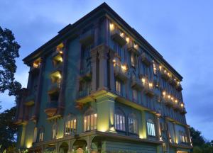 a blue building with christmas lights on it at At Pingnakorn Huaykaew in Chiang Mai