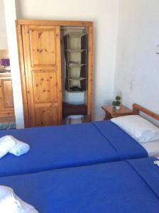 Postel nebo postele na pokoji v ubytování Ariadne Studios