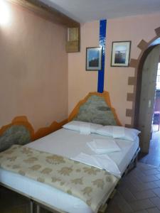 a bedroom with a bed in a room at Ecochiocciola in Montese +65 photos
