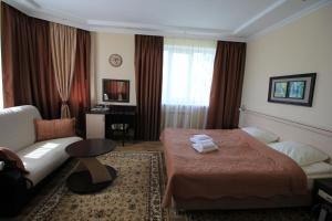 מיטה או מיטות בחדר ב-Guesthouse na Wolodarke