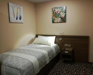 Кровать или кровати в номере Hotel zum Weissen Ochsen