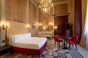 Room Of Andrea Hotel客房内的一张或多张床位
