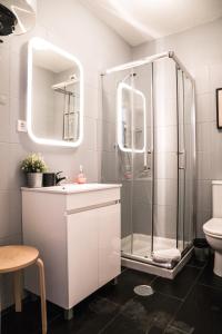 a bathroom with a shower and a sink at Downtown Residence by Apartments2Enjoy in Porto