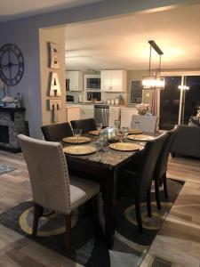 a dining table and chairs in a living room at Sedona Red Rock Garden of Paradise Pets friendly and Hot tub in Sedona