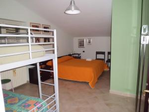 a bedroom with a bed and a bunk bed at Casetta dei "Prati" in Vaglio di Basilicata