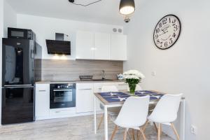 Kuchyňa alebo kuchynka v ubytovaní Elite Apartments Downtown Premium