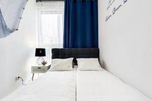 Posteľ alebo postele v izbe v ubytovaní Elite Apartments Downtown Premium
