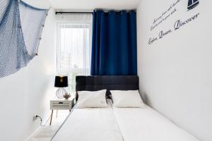Posteľ alebo postele v izbe v ubytovaní Elite Apartments Downtown Premium