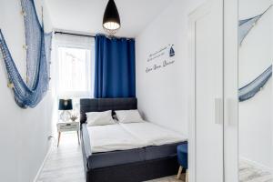 Posteľ alebo postele v izbe v ubytovaní Elite Apartments Downtown Premium