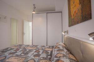 Postel nebo postele na pokoji v ubytování Apartman Madonnina