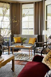 a living room with a couch and a table at The Cliffside Inn in Newport