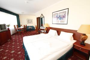 Postel nebo postele na pokoji v ubytování Hotel Lafonte