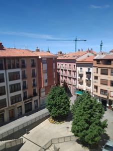 a group of buildings with trees in a courtyard at GASCON7.4 in Teruel