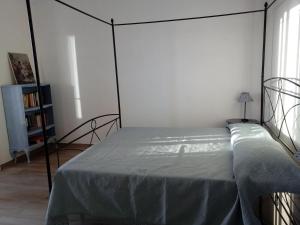 Posteľ alebo postele v izbe v ubytovaní Appartamento Leccino con piscina - Riva Trigoso