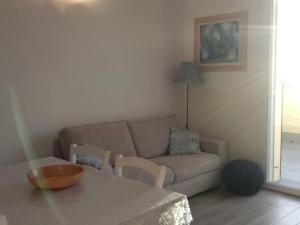 Posedenie v ubytovaní Appartamento Leccino con piscina - Riva Trigoso