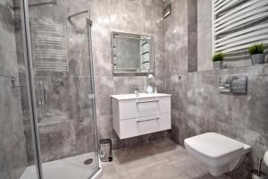 Kúpeľňa v ubytovaní AMD Apartamenty Bliżej Morza + 25 fotografií