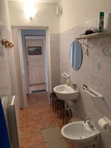 
a bathroom with a sink and a toilet at Borgo dei Pescatori Lecco in Lecco

