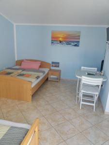 Postel nebo postele na pokoji v ubytování Apartmani Nina