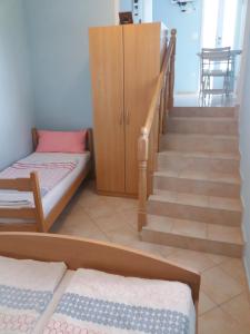 Postel nebo postele na pokoji v ubytování Apartmani Nina