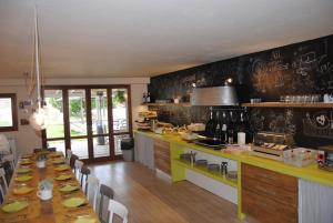 a kitchen with a long long table in a room at Agriturismo Villa Le Vigne in Montevarchi