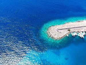 an aerial view of a small island in the ocean at Hotel Ferah in Kaş